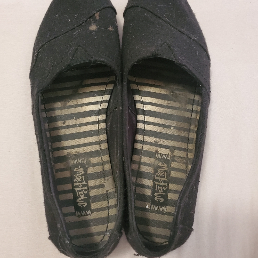 Very worn and dirty slip on shoes